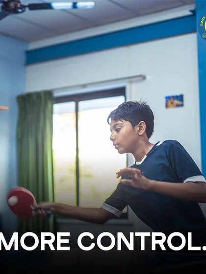 More control. A young player returns a shot with focus, demonstrating the control learned through our drills.
