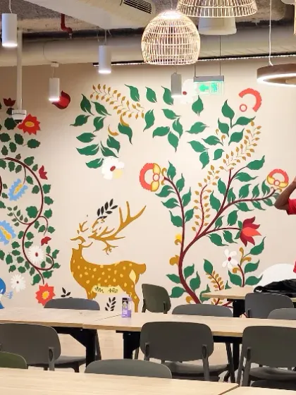 A moment of celebration after completing the Databricks office mural. This artwork, inspired by traditional Indian styles, brings a unique cultural identity to the modern tech workspace.