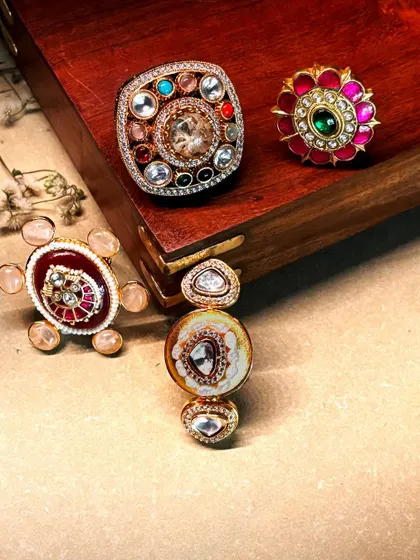 A beautiful arrangement of four of our handcrafted rings, each a small work of art.