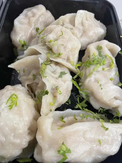 A close-up of my simple and delicious home-cooked Chicken Steam Momos. They have a soft, delicate wrapping and a juicy, flavourful filling, served fresh and hot.