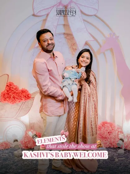 This photo captures the happy new parents with their baby girl in front of the stunning Dior-inspired backdrop. These are the elements that stole the show at Kaashvi's baby welcome.