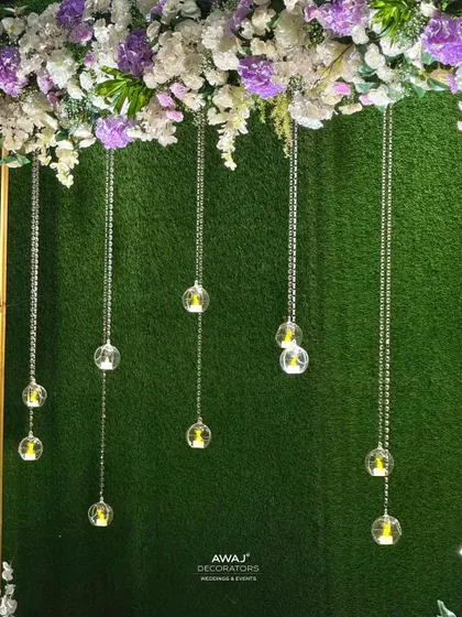 A close-up of the hanging crystal and candle details, adding a touch of sparkle to the photo booth.