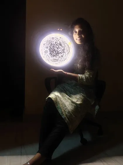 A shot showing how the moon lamp creates a focal point in a dark room. The light it emits is soft and warm, perfect for creating a relaxing atmosphere.