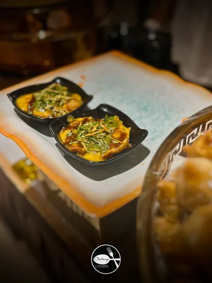 Two bowls of Samosa Ragada Chaat, ready to be devoured. The layers of texture and flavor make this one of the most popular items on my chaat menu.