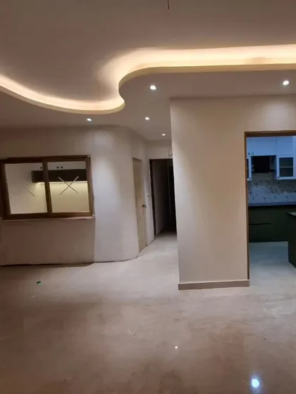 Another angle of the "flow" design. The soft, integrated lighting highlights the organic shapes and polished floors, creating a warm and inviting ambiance.