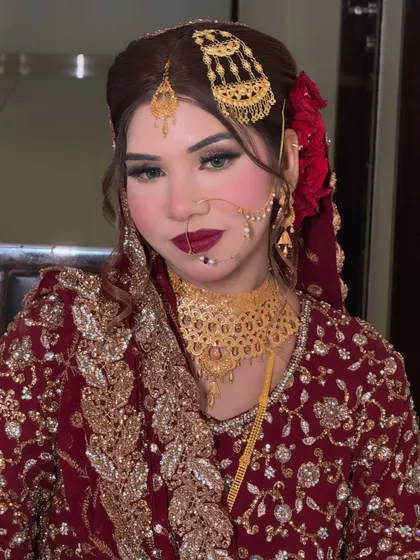 A beautiful portrait of the bride looking directly at the camera. Her confidence shines through, enhanced by the bold and glamorous makeup.