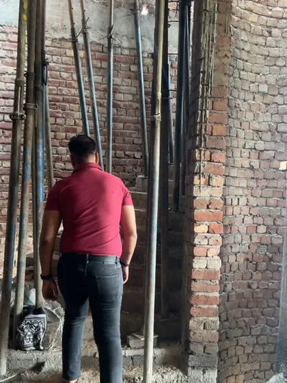 Checking the structural supports and brickwork on a multi-level construction project. A strong foundation is everything.