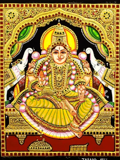 An unframed view of the Gaja Lakshmi Tanjore painting. The detail in the elephants, the goddess's expression, and the shimmering gold foil are all clearly visible, showcasing the quality of our craftsmanship.