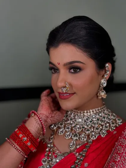 A close-up of the bridal look, showing how the drape complements the stunning kundan jewellery and bold makeup.