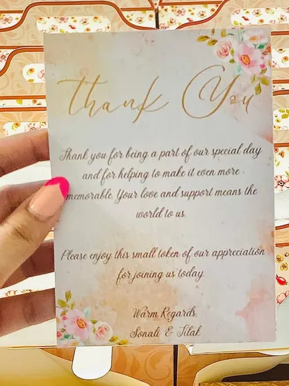 Each wedding favor comes with a personalized thank you card from the couple, adding a heartfelt touch.