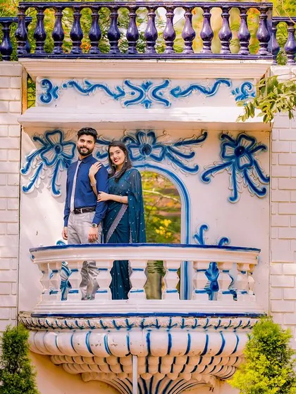 A wide shot of the Santorini-inspired balcony, showcasing its beautiful blue and white design.