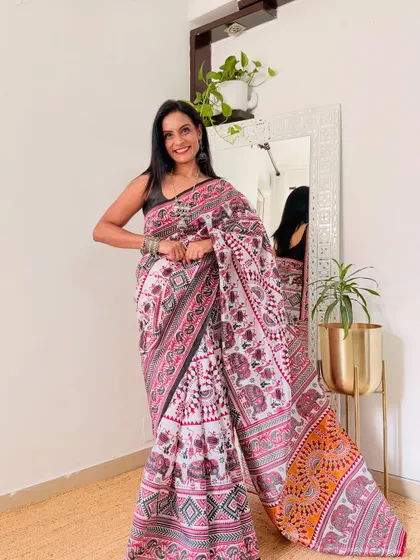 This white saree with a traditional elephant motif print is a beautiful blend of classic and contemporary. It's a great conversation starter at the office.