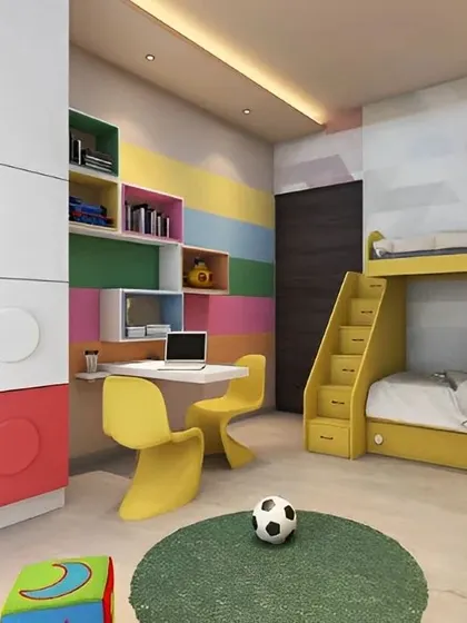 We brought the fun of LEGOs into this kids' room with a custom-built wardrobe featuring colorful, block-shaped details. The room also includes a bright yellow bunk bed with stairs and a matching dual-seater study desk.