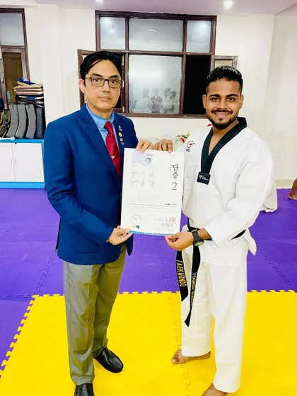 Receiving my 2nd Dan Black Belt certificate from Grandmaster Pervez Khan at my academy. Every new level is a responsibility to teach and inspire better.