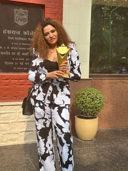 Another shot with my award outside Hansraj College. This trophy is a symbol of the relentless effort and passion I pour into my work every single day.
