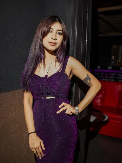 A photo from my gig in Bahrain. I loved this purple dress, it perfectly matched the club's lighting and vibe.