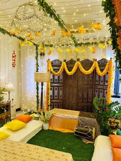 Another look at this beautiful Dholki night decor. The combination of artificial grass, low seating, and sparkling chandeliers transformed the room completely.