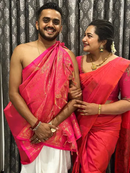A sweet, candid moment shared between the couple, highlighting their coordinated outfits.