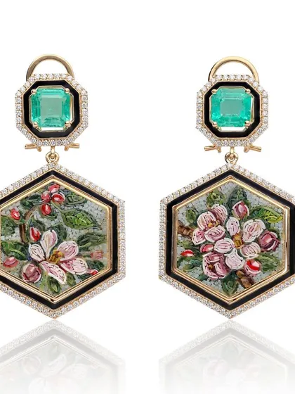 Art Deco meets nature in these hexagonal earrings. The micromosaic panels depict apple blossoms and berries, framed with black enamel and diamonds, and topped with beautiful Zambian emeralds from Gemfields.