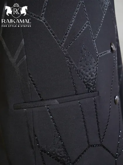A close-up of the pocket detail on the black geometric Jodhpuri.