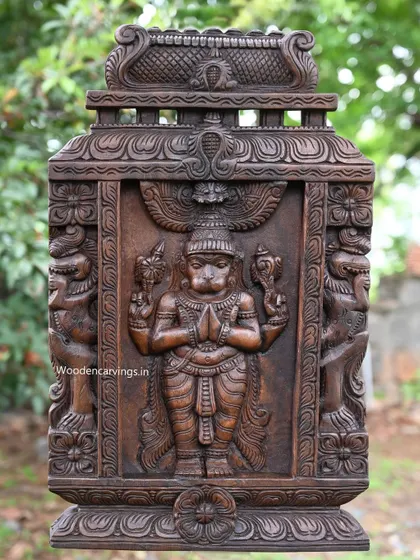 The full Hanuman Kavadi, showing the intricate frame and side figures that complete the portable shrine.