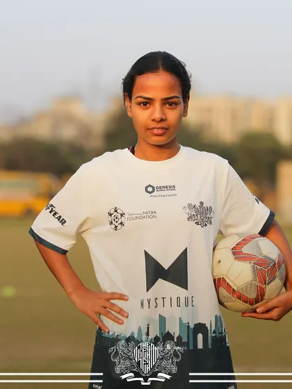 Holding the football, this player is ready to make her mark on the game. Our program is a platform for talented female athletes to shine.
