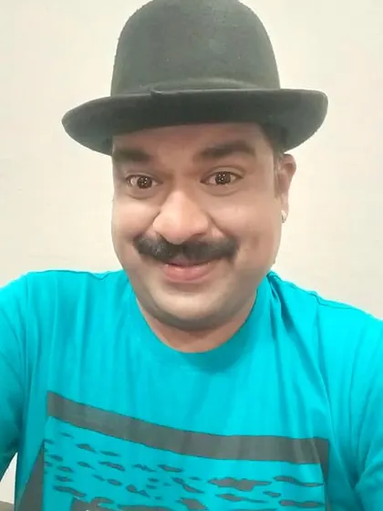 A happy selfie wearing a bowler hat for a role in the movie 'First Night with Devva'. It has a bit of a Charlie Chaplin feel to it.