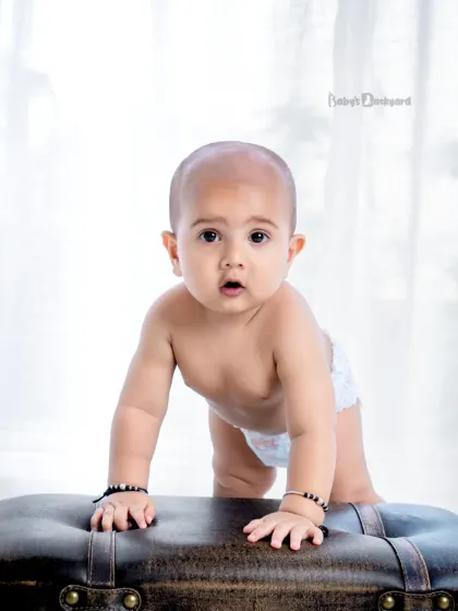 A little smile can melt the hardest hearts. This simple, bright portrait captures pure innocence.