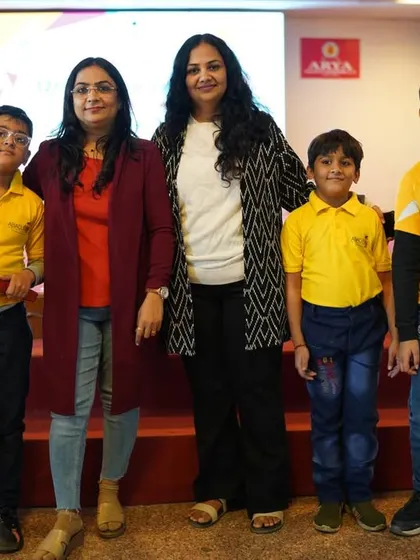 Our founder with parents and students, highlighting the family and community aspect of our academy.