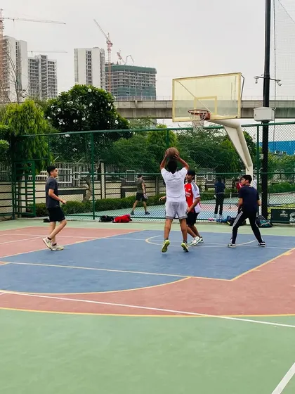 A jump shot from the free-throw line during a competitive practice match.