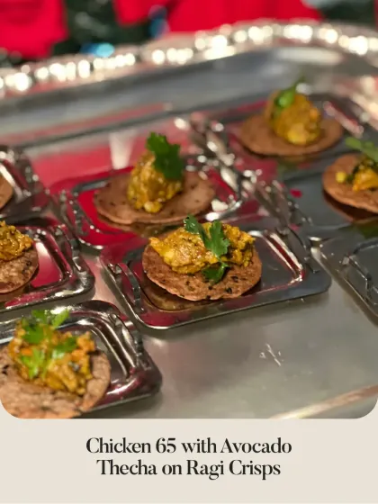 A fusion of flavors: Chicken 65 with Avocado Thecha served on Ragi Crisps. A spicy, modern take on a classic Indian appetizer.