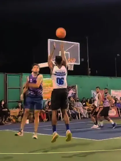 Taking a jump shot over a defender at the DG Cup.