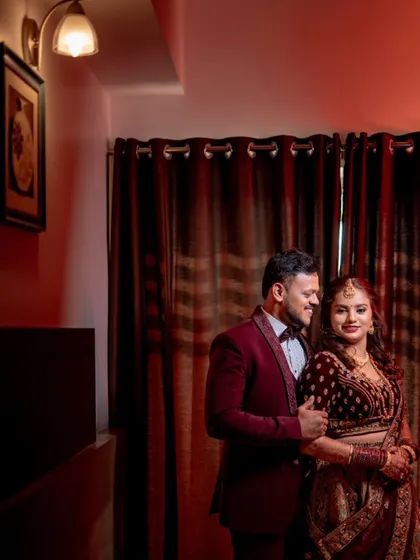 A classic, romantic portrait of a couple at their reception, the warm lighting creating an intimate mood.
