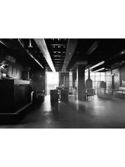 An atmospheric, black and white wide shot of the club before the crowds arrive. A moment of calm before the storm.