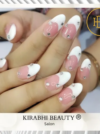 A delicate and romantic design. I used a soft pink and white base and placed individual rhinestones to create a subtle, sparkling heart shape.