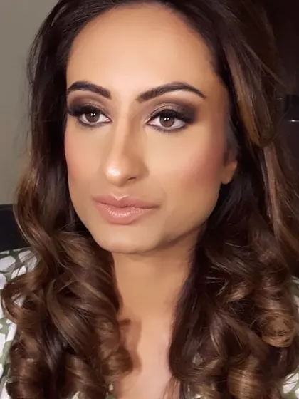 The same client with her eyes open, showcasing how a bold smokey eye can beautifully define and enhance the eyes for a party or wedding reception.