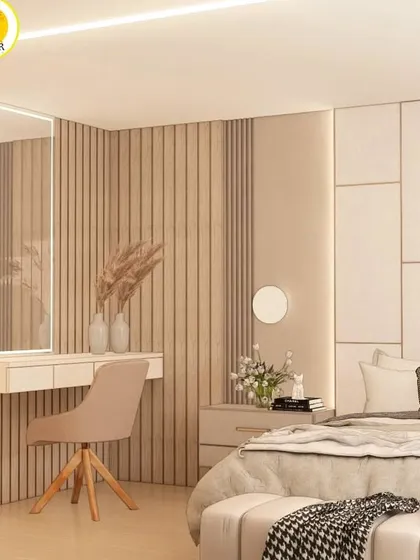 The dressing area in this bedroom features a vanity with a large backlit mirror and a fluted wood accent wall.