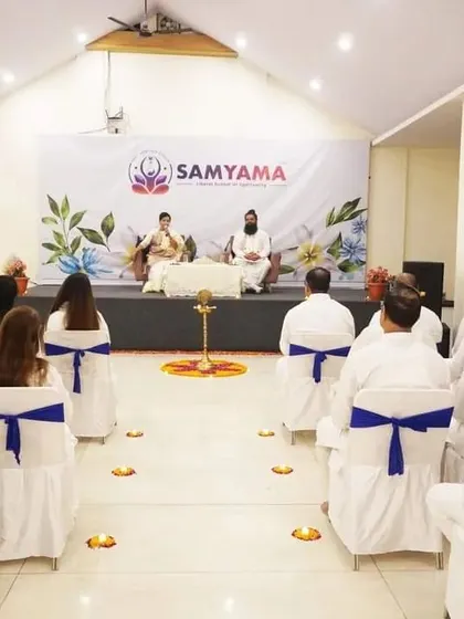 A wide shot of a Satsang in Himachal, showing the peaceful and attentive audience.