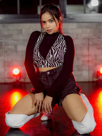 An edgy studio look with dramatic red backlighting. This setup is perfect for dance portfolios or fashion shoots that need a bold, energetic vibe.