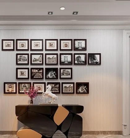 A wider view of the gallery wall, positioned above a funky, modern console table. This combination of classic photography and contemporary furniture creates a dynamic and interesting space.