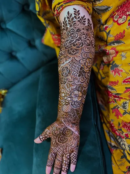 A single arm view of a full bridal floral design, showing the intricate patterns and shading that create a beautiful texture.