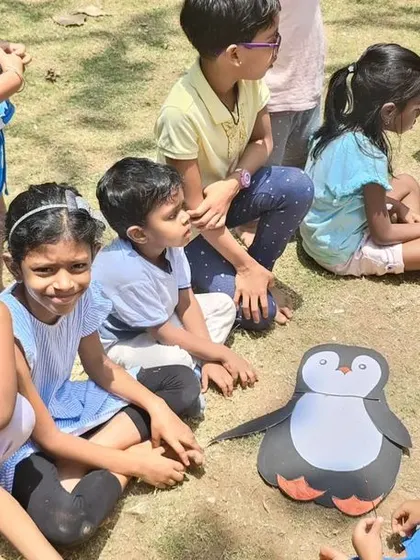 Learning about different animals and their habitats during a summer camp activity. The plush penguin was a big hit and sparked a great conversation about Antarctica.