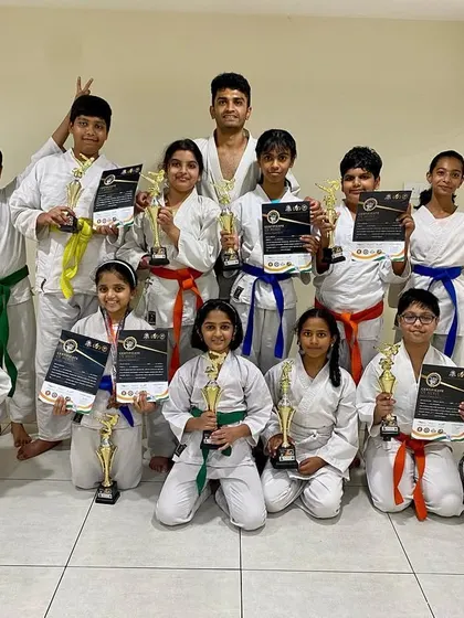 Our students from the Purva Belmont dojo show off their impressive collection of trophies and certificates after a successful outing at the Independence Day Cup in Bangalore.