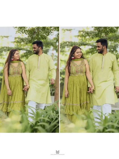 A lovely walking shot of the couple, hand in hand, during their Mehandi ceremony. Their coordinated outfits look beautiful against the lush green background.