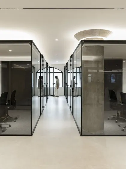 A view of the glass-walled offices at the Sushee headquarters, designed to promote transparency and a sense of calm. The clean lines and uncluttered aesthetic reflect our belief that a workplace should be an orderly environment that supports focus and collaboration.