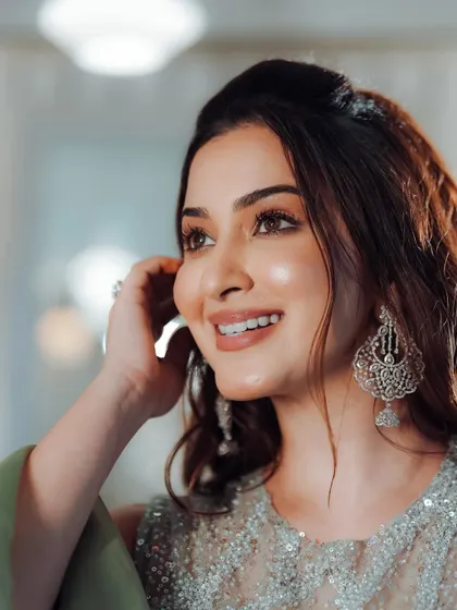 A close up on that flawless skin. The makeup is dewy and natural, letting her beauty shine through.