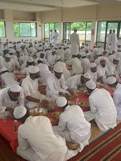 A candid photo of the guests during the meal at the madrasa. Providing satisfying and delicious food for such events is a core part of my service.