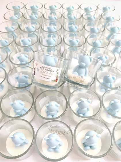An army of adorable light blue teddy bear candles in votive jars, made for Brendon's First Holy Communion. This design is also a hit for first birthdays.