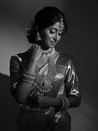 A classic black and white portrait of a South Indian bride. This timeless editing style highlights the importance of strong contouring, defined eyes, and flawless skin application in my makeup technique.
