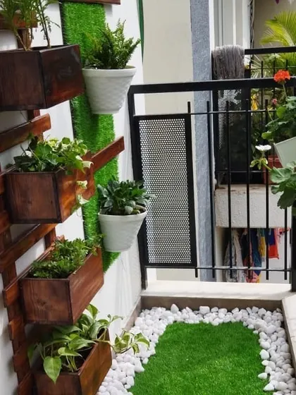 The base of the vertical garden, showing how we use a mix of trailing and upright plants to create a full, lush look from top to bottom.